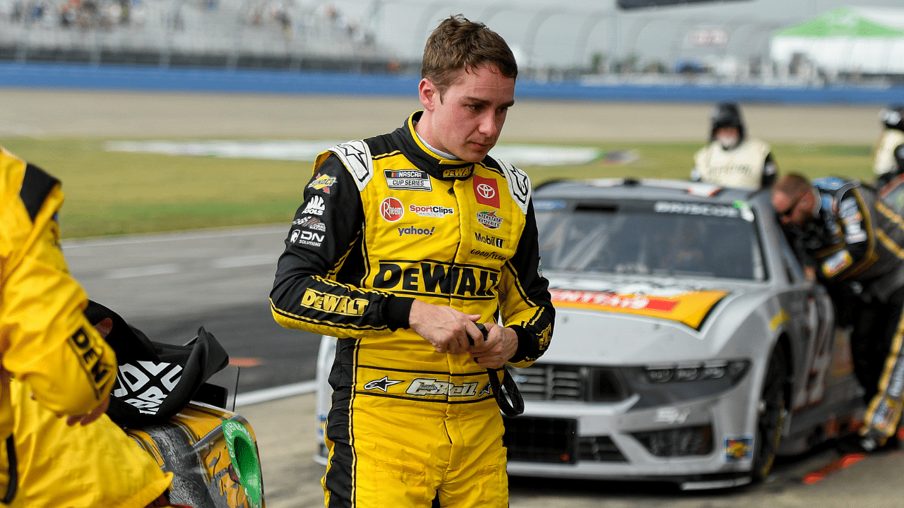 NASCAR Cup Series driver Christopher Bell (20) exits the car after a red flag for rain during the Ally 400 at Nashville Superspeedway.