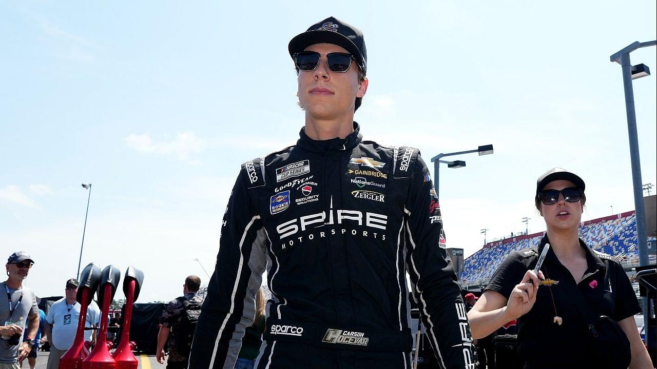 NASCAR Cup Series driver Carson Hocevar walks down pit lane prior to practice for the Cook Out Southern 500 at Darlington Raceway.