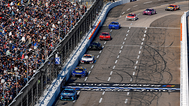 NASCAR Cup Series driver Martin Truex Jr. (19) leads the field down the front stretch during the Xfinity 500 at Martinsville Speedway.