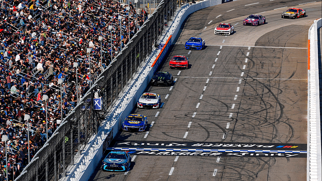 NASCAR Cup Series driver Martin Truex Jr. (19) leads the field down the front stretch during the Xfinity 500 at Martinsville Speedway.