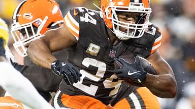 Cleveland Browns running back Nick Chubb (24) leaps through a gap against the Pittsburgh Steelers during the second quarter at Huntington Bank Field Stadium.