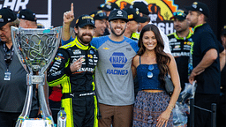 NASCAR Cup Series driver Ryan Blaney (left) celebrates with Chase Elliott (center) and Gianna Tulio after winning the 2023 NASCAR Cup Series Championship at Phoenix Raceway.