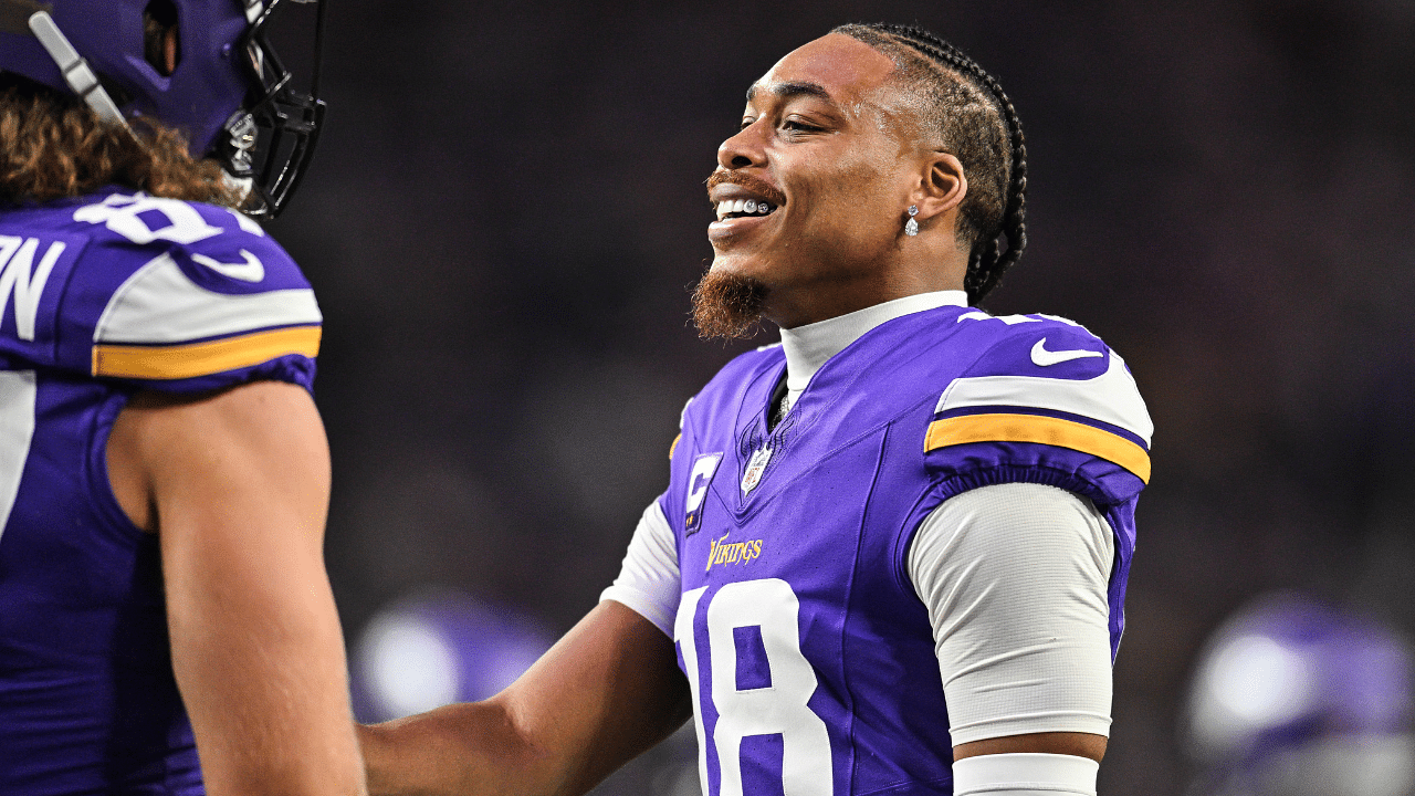 Minnesota Vikings wide receiver Justin Jefferson (right) reacts with tight end T.J. Hockenson (87) before the game against the Indianapolis Colts at U.S. Bank Stadium.