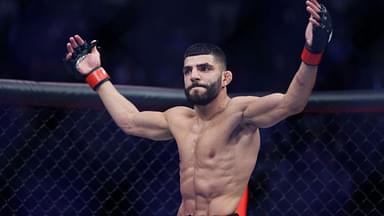 Amir Albazi (red gloves) reacts after defeating Francisco Figueiredo (blue gloves) during UFC 278 at Vivint Arena.