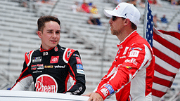 NASCAR Cup Series driver Christopher Bell (20) and NASCAR Cup Series driver Denny Hamlin (11) ride to pit road before the start of the Quaker State 400 at Atlanta Motor Speedway.