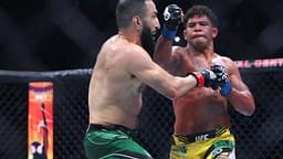 Belal Muhammad (red gloves) fights Gilbert Burns (blue gloves) during UFC 288 at Prudential Center.