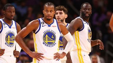 Golden State Warriors guard Moses Moody (4), forward Jonathan Kuminga (00) and forward Draymond Green (23) against the Phoenix Suns at Footprint Center.