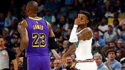 Memphis Grizzlies guard Ja Morant (12) reacts toward Los Angeles Lakers forward LeBron James (23) after a three point basket during the first half at FedExForum.