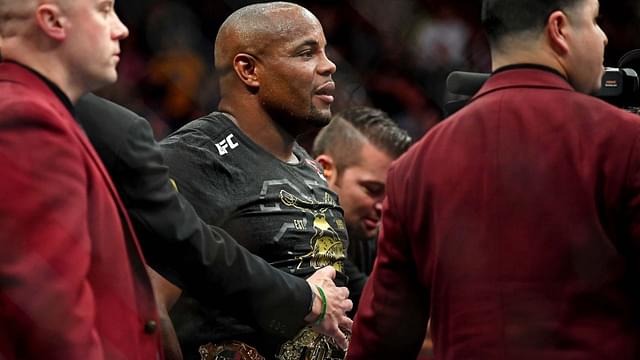 Daniel Cormier (blue gloves) celebrates beating Stipe Miocic (red gloves) during UFC 226 at T-Mobile Arena.