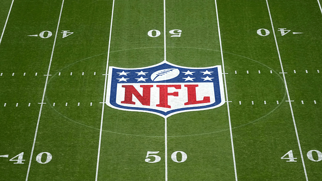 The NFL shield logo at midfield during the 2024 NFL Munich Game at Allianz Arena.