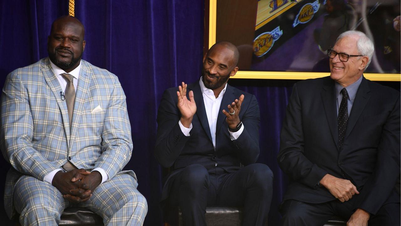 Shaquille O'Neal (left), Kobe Bryant (center) and Phil Jackson react during ceremony to unveil statue of former Los Angeles Lakers center O'Neal at Staples Center.