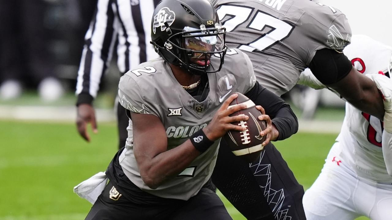 Nov 16, 2024; Boulder, Colorado, USA; Colorado Buffaloes quarterback Shedeur Sanders (2) carries the ball in the second half against the Utah Utes at Folsom Field.