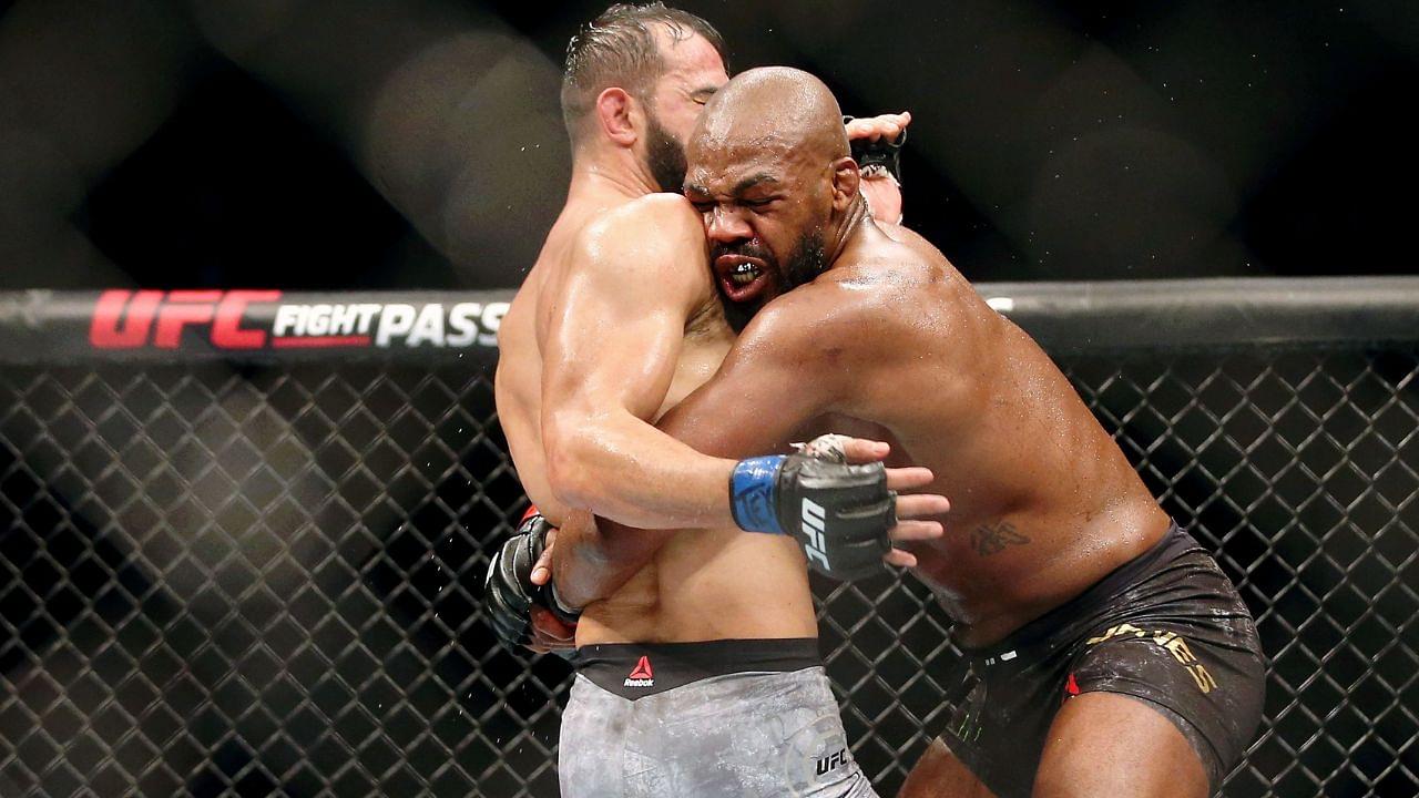 Jon Jones (red gloves) fights Dominick Reyes (blue gloves) during UFC 247 at Toyota Center.