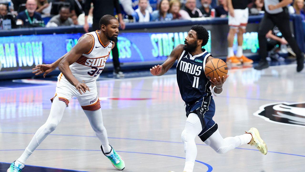 Dallas Mavericks guard Kyrie Irving (11) drives to the basket as Phoenix Suns forward Kevin Durant (35) defends during the fourth quarter at American Airlines Center.