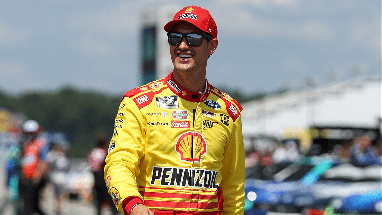 NASCAR Cup Series driver Joey Logano walks on pit road during practice and qualifying for the The Great American Getaway 400 at Pocono Raceway.