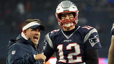 New England Patriots quarterback Tom Brady (12) talks with offensive coordinator Josh McDaniels before the start of the game against the Dallas Cowboys at Gillette Stadium.