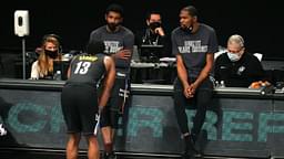 Brooklyn Nets point guard Kyrie Irving (C) and power forward Kevin Durant (R) talk to shooting guard James Harden (13) before checking into the game during the fourth quarter against the Los Angeles Clippers at Barclays Center.