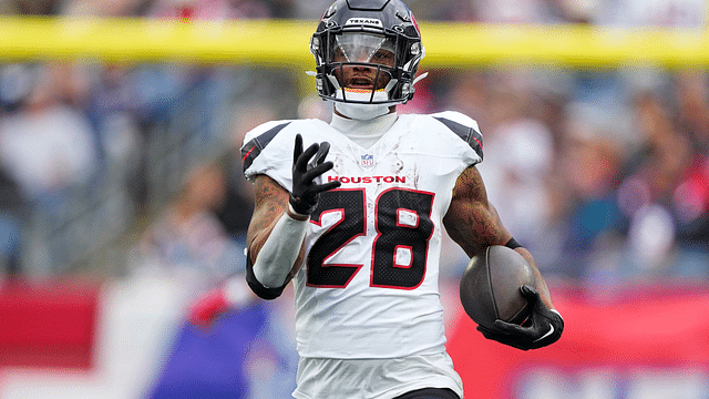 Oct 13, 2024; Foxborough, Massachusetts, USA; Houston Texans running back Joe Mixon (28) runs with the ball against the New England Patriots during the first half at Gillette Stadium. Mandatory Credit: Gregory Fisher-Imagn Images