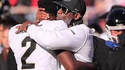 Colorado football coach Deion Sanders hugs his son, Shedeur Sanders, before facing Texas Tech in a Big 12 football game Saturday, Nov. 9, 2024, at Jones AT&T Stadium.