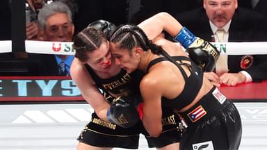 Amanda Serrano (red gloves) fights Katie Taylor(blue gloves) at AT&T Stadium