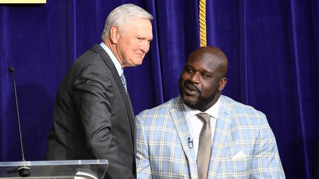 Jerry West (left) shakes hands with Los Angeles Lakers former center Shaquille O'Neal during ceremony to unveil statue of O'Neal at Staples Center.