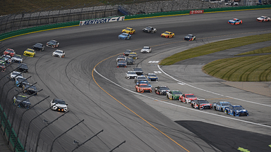 NASCAR Cup Series drivers break for pit road at the end of the first stage during the Quaker State 400 at Kentucky Speedway.