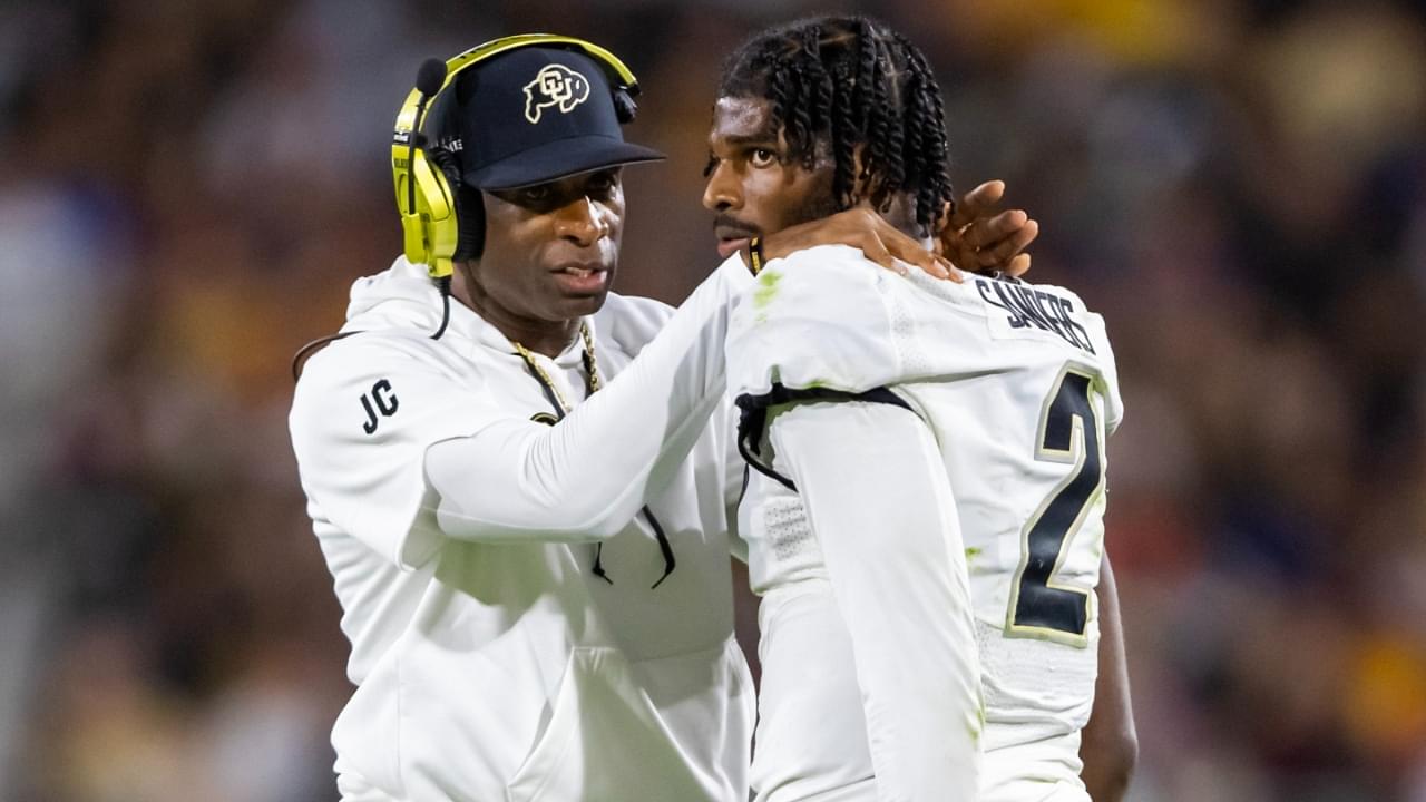 Oct 7, 2023; Tempe, Arizona, USA; Colorado Buffaloes head coach Deion Sanders reacts as he talks to son and quarterback Shedeur Sanders (2) after a penalty against the Arizona State Sun Devils in the second half at Mountain America Stadium.