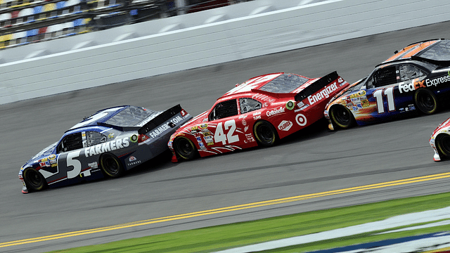 NASCAR Sprint Cup Series drivers Kasey Kahne (5) and Juan Pablo Montoya (42) and Denny Hamlin (11) draft during practice for the Daytona 500 at Daytona International Speedway.