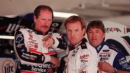 Dale Earnhardt points something out to Rusty Wallace in the garage during practice at Daytona International Speedway on Wednesday, February 16, 2000.