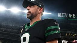 New York Jets quarterback Aaron Rodgers (8) walks off the field after the Jets win over the Houston Texans at MetLife Stadium.