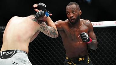 ; Leon Edwards (red gloves) fights Colby Covington (blue gloves) during UFC 296 at T-Mobile Arena.