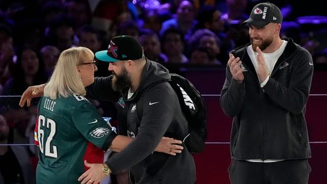 Donna Kelce hugs her son Philadelphia Eagles center Jason Kelce (62) while her other son Kansas City Chiefs tight end Travis Kelce (87) claps at the Footprint Center in downtown Phoenix during the NFL's Super Bowl Opening Night on Feb. 6, 2023. Nfl Super Bowl Lvii Opening Night Kansas City Chiefs