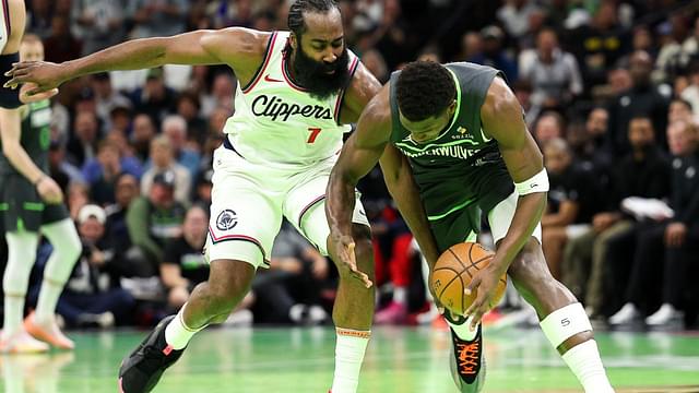 Minnesota Timberwolves guard Anthony Edwards (5) and LA Clippers guard James Harden (1) compete for the ball during the second half of an NBA Cup game at Target Center.