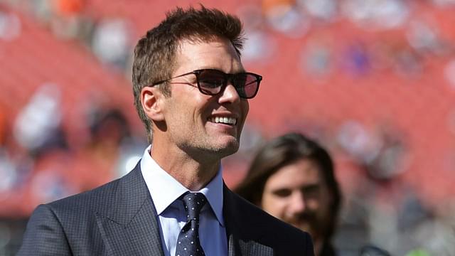 NFL legend Tom Brady is all smiles before an NFL football game at Huntington Bank Field, Sunday, Sept. 8, 2024, in Cleveland, Ohio.