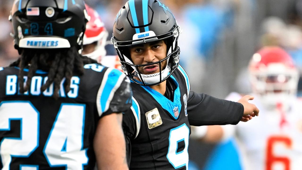 Nov 24, 2024; Charlotte, North Carolina, USA; Carolina Panthers quarterback Bryce Young (9) talks to running back Jonathon Brooks (24) in the fourth quarter at Bank of America Stadium.