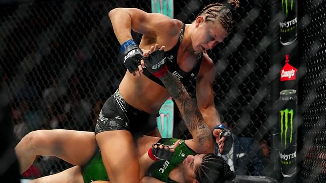 Ketlen Vieira (red gloves) fights Kayla Harrison (blue gloves) during UFC 307 at Delta Center.