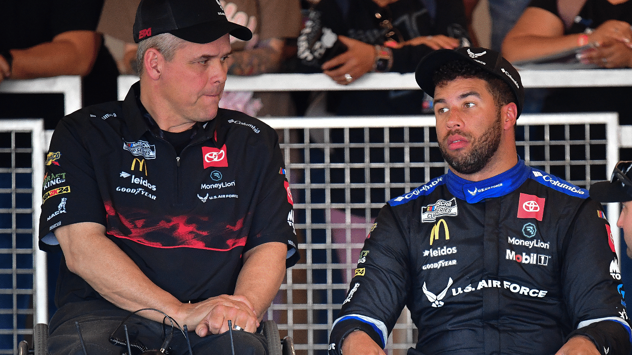 NASCAR Cup Series driver Bubba Wallace (23) with crew chief Bootie Barker during Cup Series practice at Phoenix Raceway.