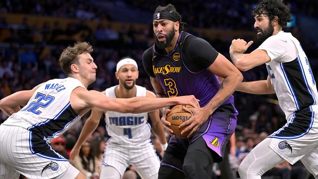 Orlando Magic forward Franz Wagner (22) and center Goga Bitadze (35) defend Los Angeles Lakers forward Anthony Davis (3) in the second half at Crypto.com Arena.