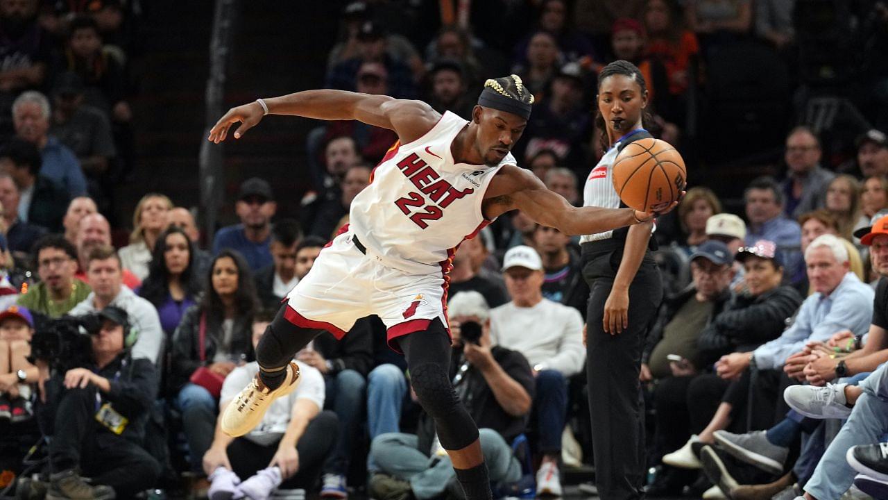 Miami Heat forward Jimmy Butler (22) saves the ball against the Phoenix Suns during the first half at Footprint Center