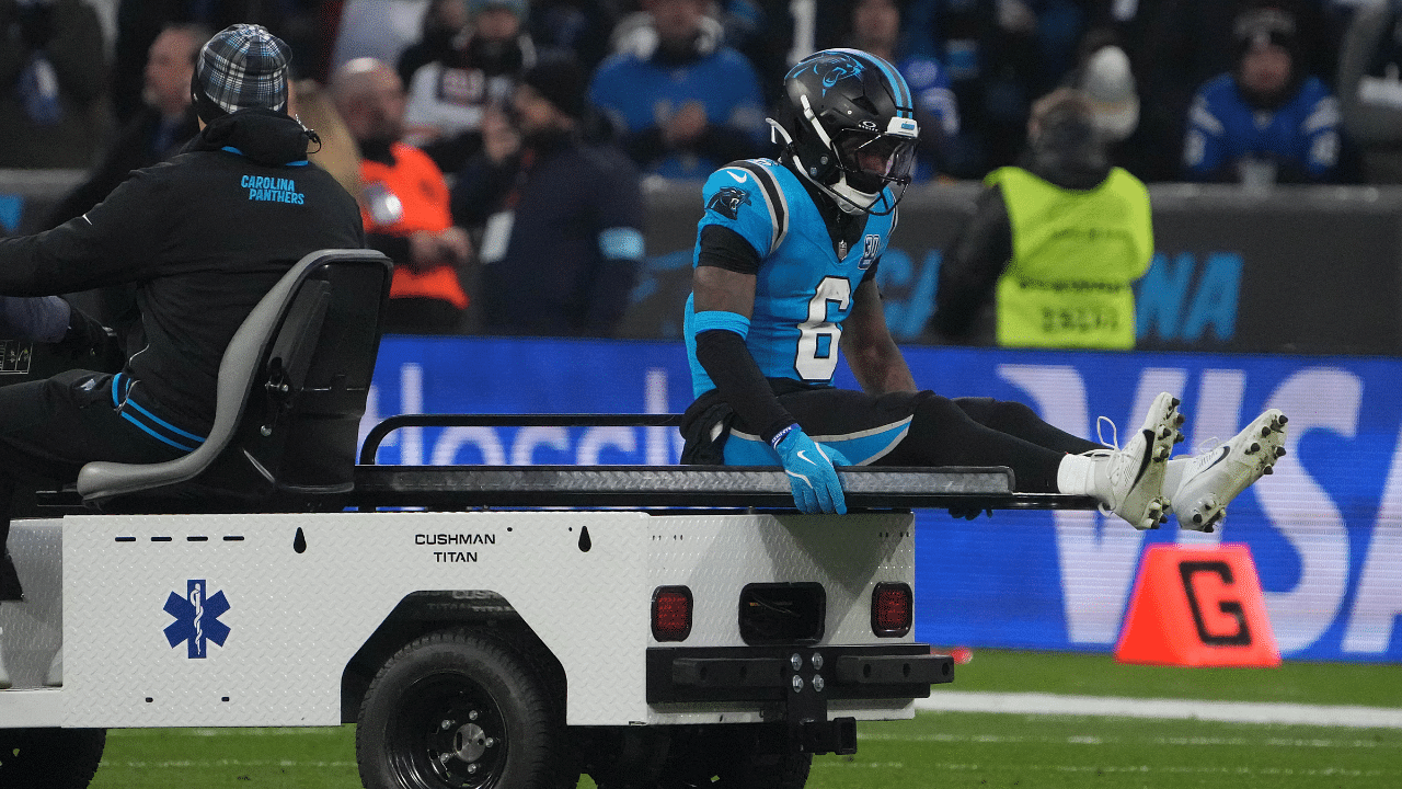 Carolina Panthers running back Miles Sanders (6) leaves the field with an injury against the New York Giants in the first half during the 2024 NFL Munich Game at Allianz Arena.