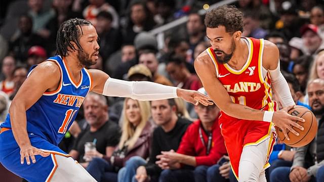 Atlanta Hawks guard Trae Young (11) is defended by New York Knicks guard Jalen Brunson (11) during the first half at State Farm Arena.