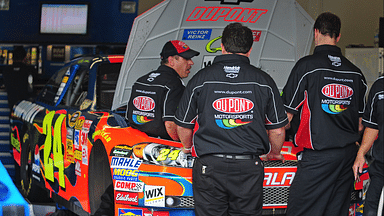 Crew members for Nascar Sprint Cup Series driver Jeff Gordon change an engine during practice for the Daytona 500 at Daytona International Speedway.