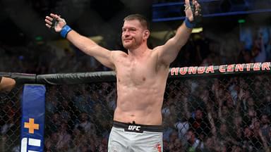 Stipe Miocic celebrates his championship victory by TKO against Daniel Cormier during UFC 241 at Honda Center.