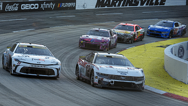 NASCAR Cup Series driver Denny Hamlin (11) and driver Ryan Blaney (12) out of turn two during the Xfinity 500 at Martinsville Speedway.