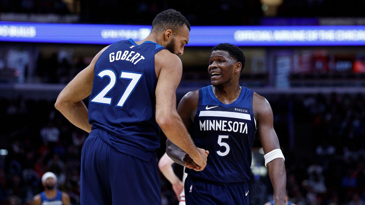 Minnesota Timberwolves center Rudy Gobert (27) reacts with guard Anthony Edwards (5) during the first half of an NBA game against the Chicago Bulls at United Center.