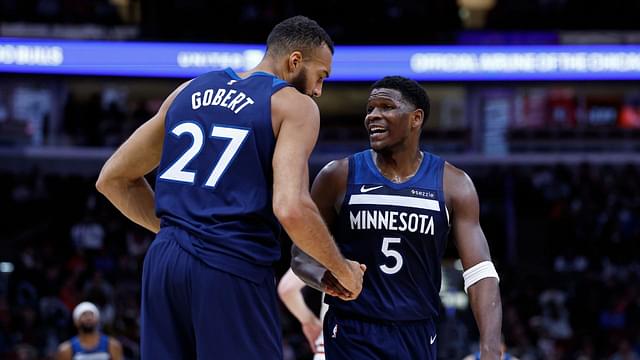 Minnesota Timberwolves center Rudy Gobert (27) reacts with guard Anthony Edwards (5) during the first half of an NBA game against the Chicago Bulls at United Center.