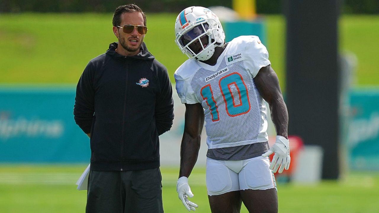 Miami Dolphins head coach Mike McDaniel talks with Miami Dolphins wide receiver Tyreek Hill (10) during practice at Baptist Health Training Complex.