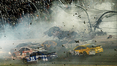 NASCAR Sprint Cup Series driver Austin Dillon car (3) crashes against the catch fence during the finish of the Coke Zero 400 at Daytona International Speedway.