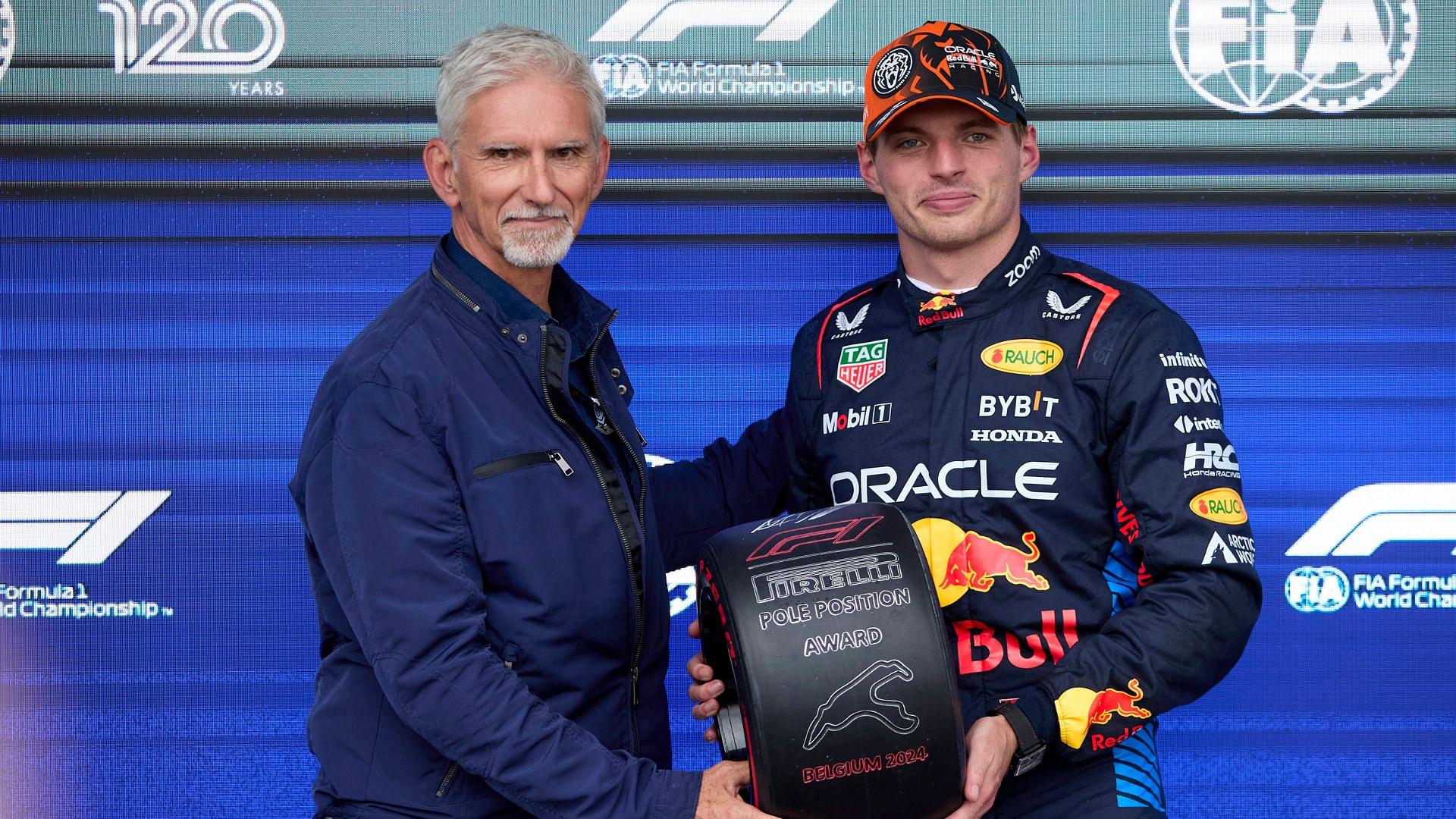 F1 Grand Prix of Hungary - Qualifying Max Verstappen of the Netherlands and Oracle Red Bull Racing receives the poleman award from Damon Hill in the parc ferme after the qualifying ahead of the F1 Grand Prix of Belgium at Circuit de Spa-Francorchamps