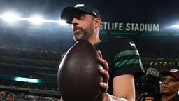 New York Jets quarterback Aaron Rodgers (8) walks off the field after the Jets win over the Houston Texans at MetLife Stadium.